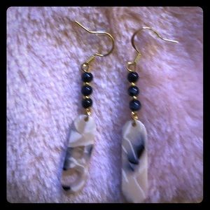 Earrings hand made black, cream, and clear resin
